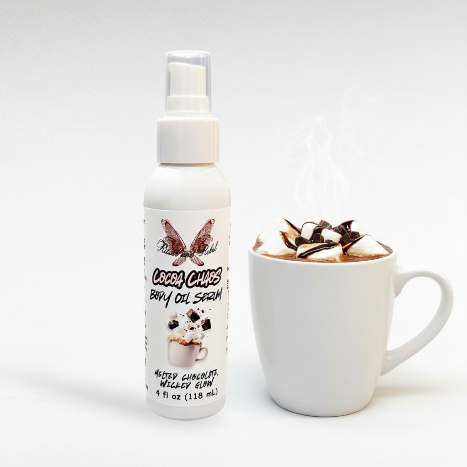 Cocoa Chaos Body Oil by Ritual and Rebel 4 oz white tall bottle with serum pump next to a cup of hot chocolate with white background
