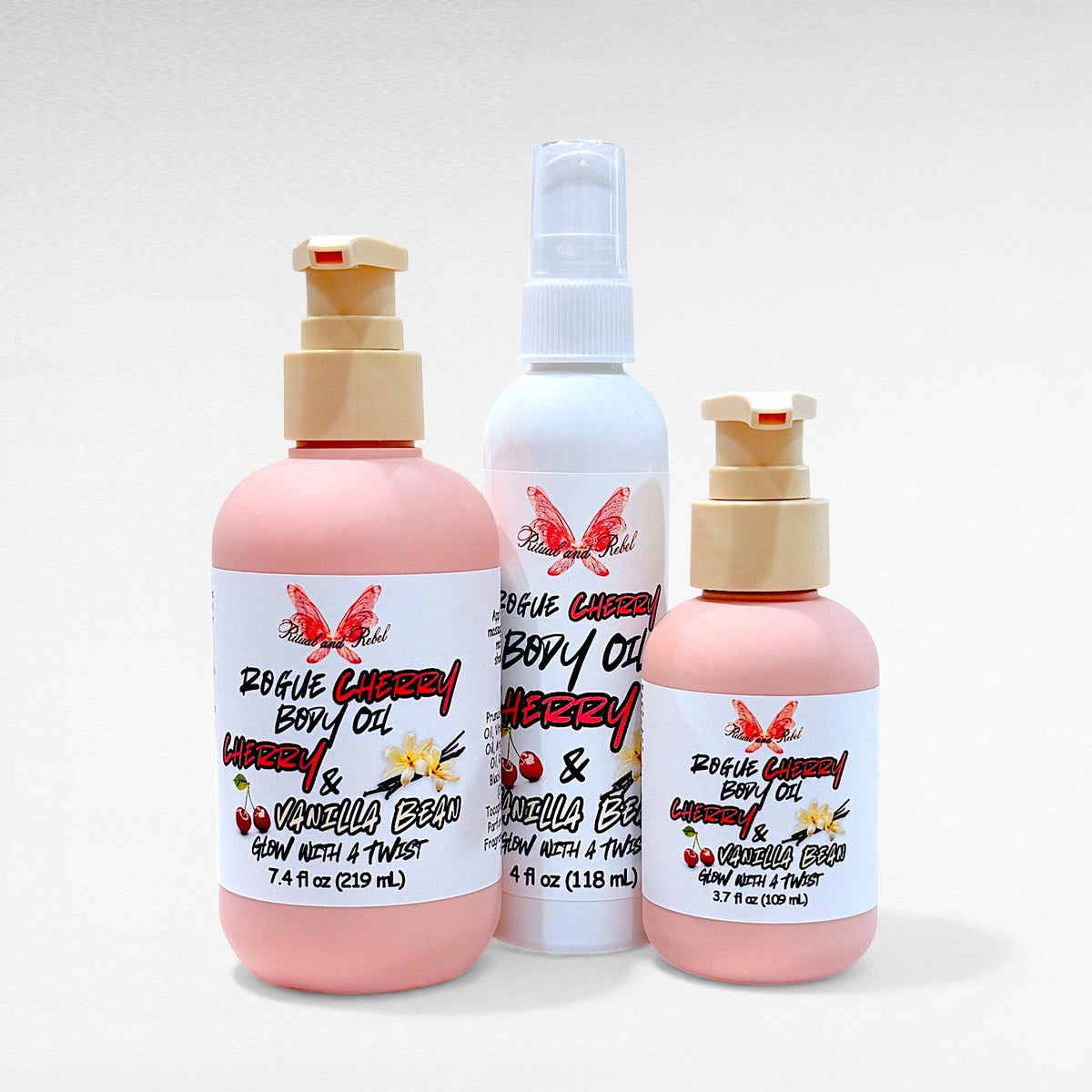 Rogue Cherry Body Oil by Ritual and Rebel 2 pink bottles with beige pumps and 1 white tall bottle 4 fl oz