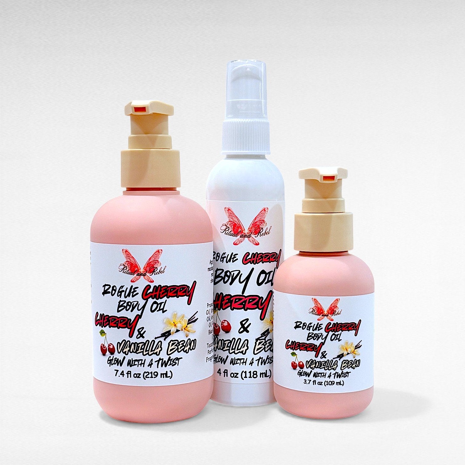 Rogue Cherry Body Oil by Ritual and Rebel 2 pink bottles with beige pumps and 1 white tall bottle 4 fl oz