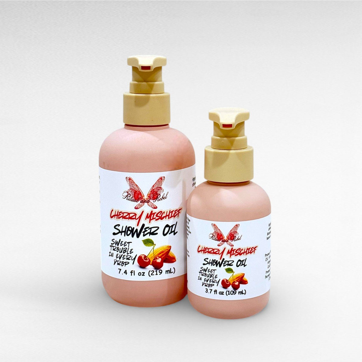Cherry Mischief Shower Oil by Ritual and Rebel 2 bottles with pumps 7.4 and 3.7 fl oz