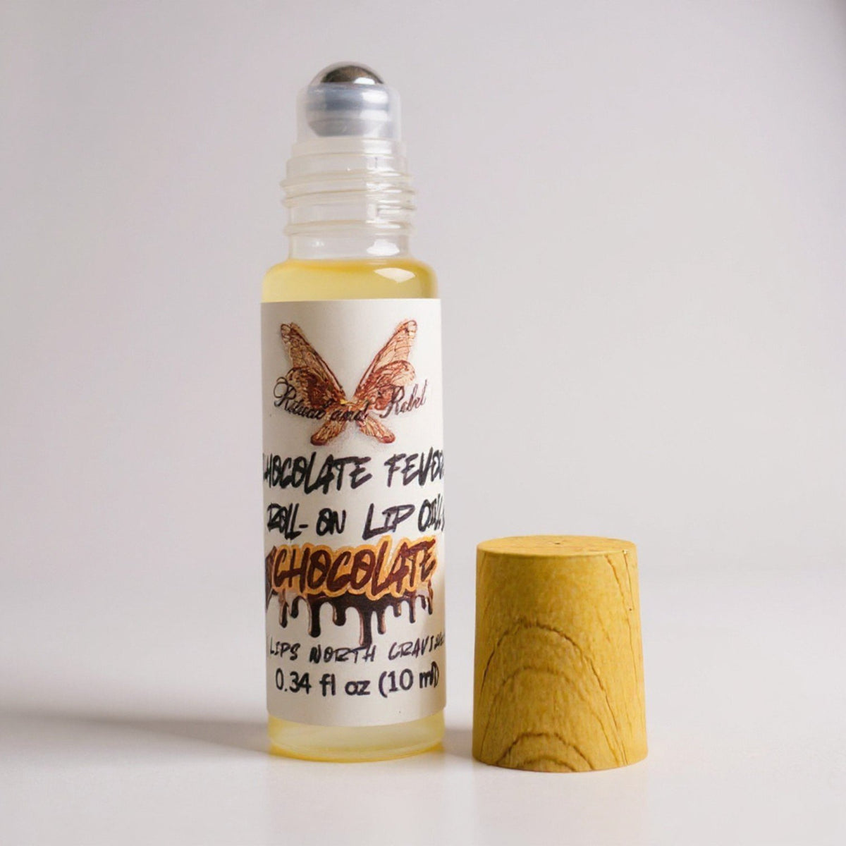 Chocolate Fever Lip Oil by Ritual and Rebel Roll-on lip oil with chocolate flavor Bamboo wood top