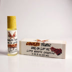 Chocolate Fever lip oil by Ritual and Rebel Roll-on lip oil with wooden applicator and packaging labeled 'Chocolate Fever' on a white background