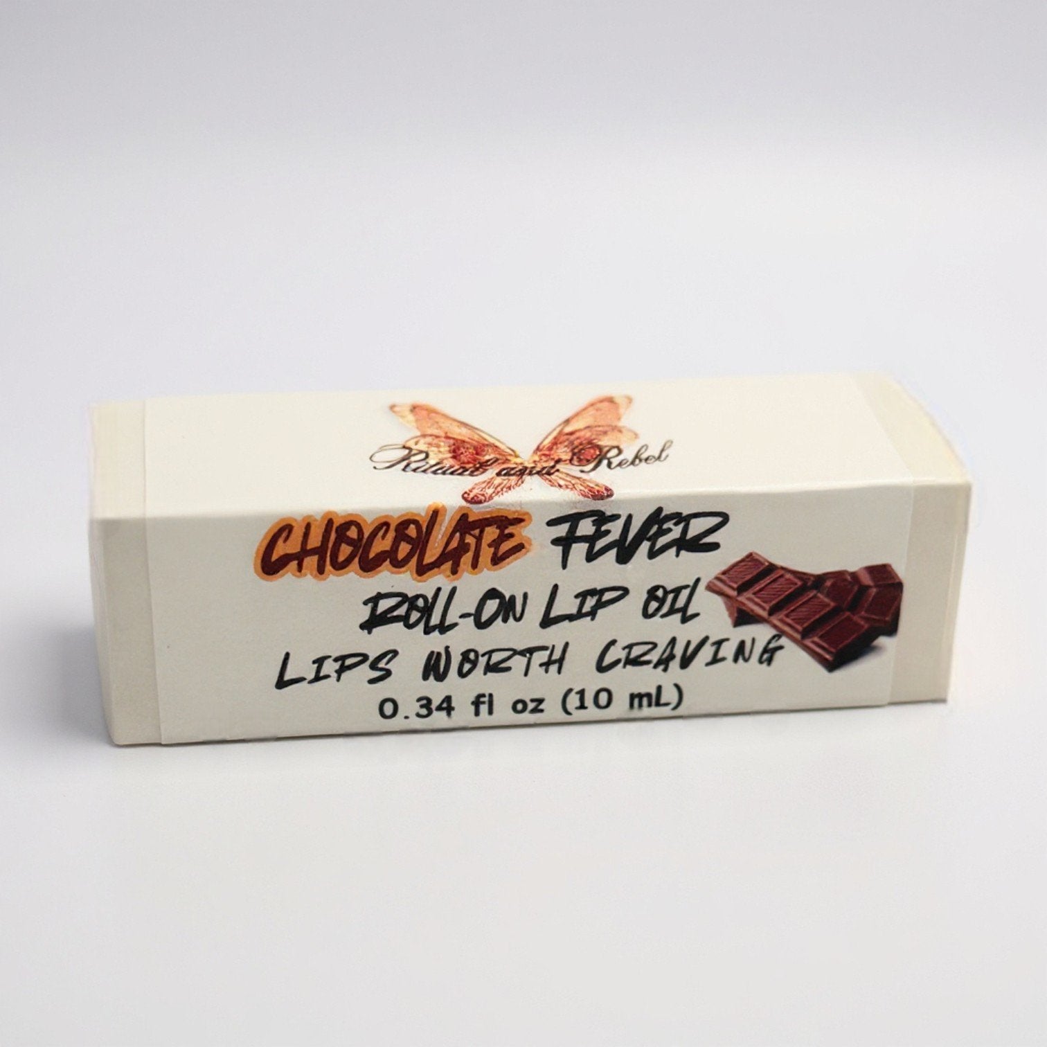 Chocolate Fever roll-on lip oil by ritual and Rebel product Box with a white background