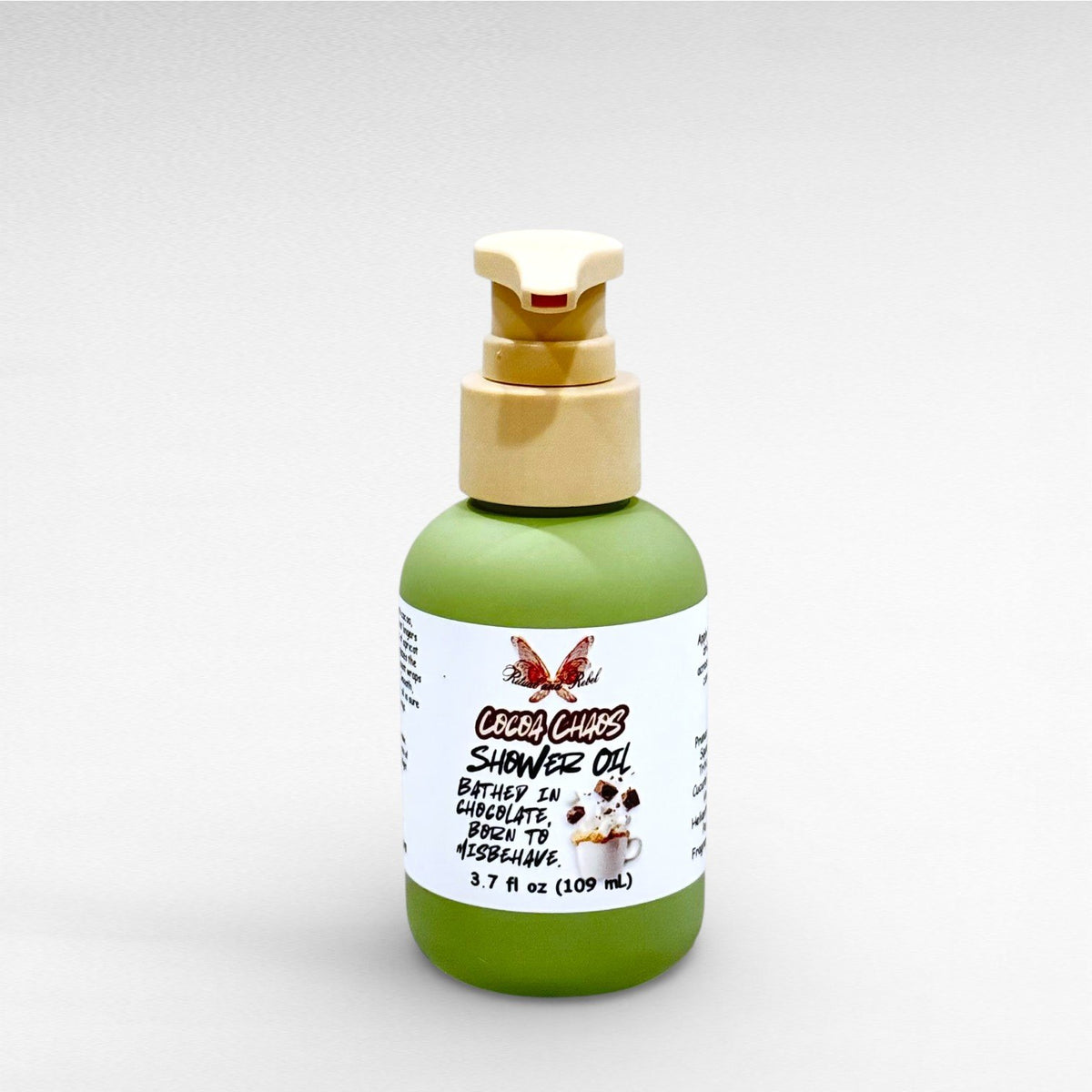 Cocoa Chaos Shower Oil by Ritual and Rebel green bottle with beige pump 3.7 fl oz