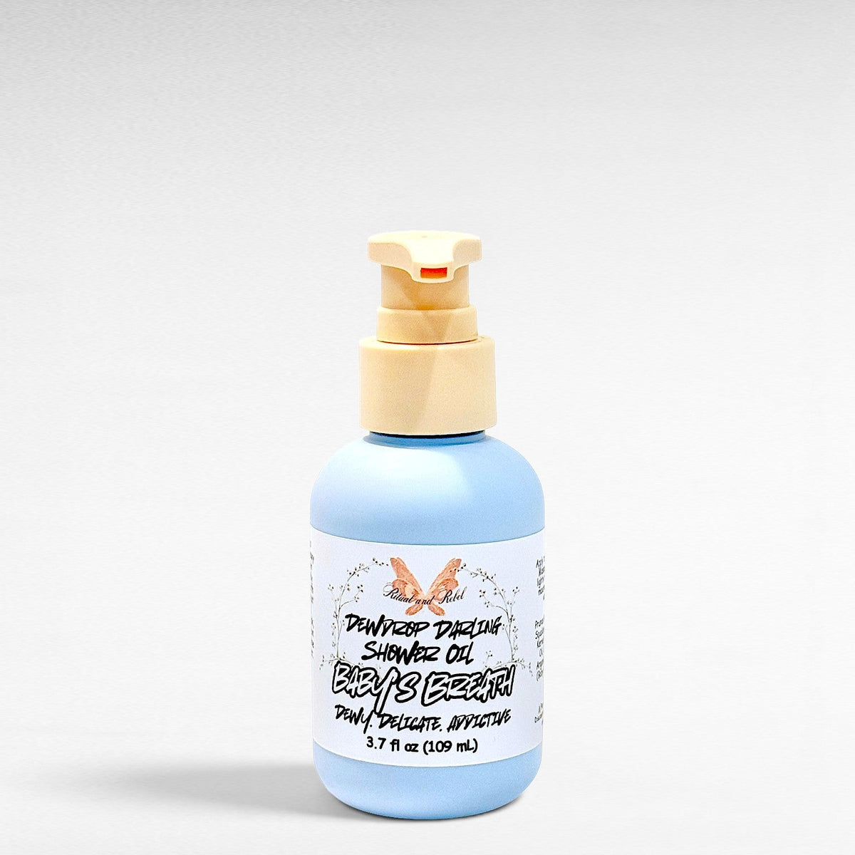 Dewdrop Darling shower oil 3.7 fl oz light blue bottle with beige pump
