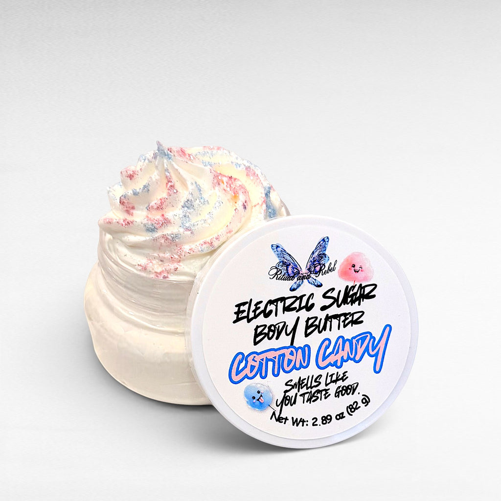 Electric Sugar Body Butter by Ritual and Rebel cream colored whipped body butter in clear plastic jar with pink and blue glitter mica on top and white round lid 2.89 oz