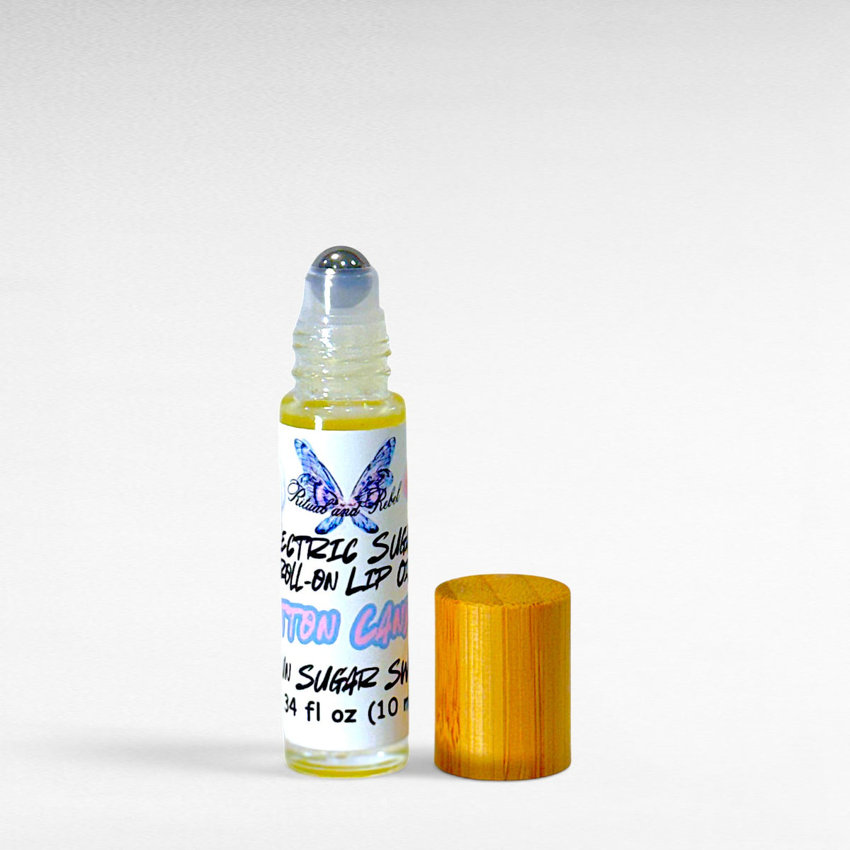 Electric Sugar cotton candy roll-on lip oil by Ritual and Rebel with glossy pink candy-inspired aesthetic on a white background