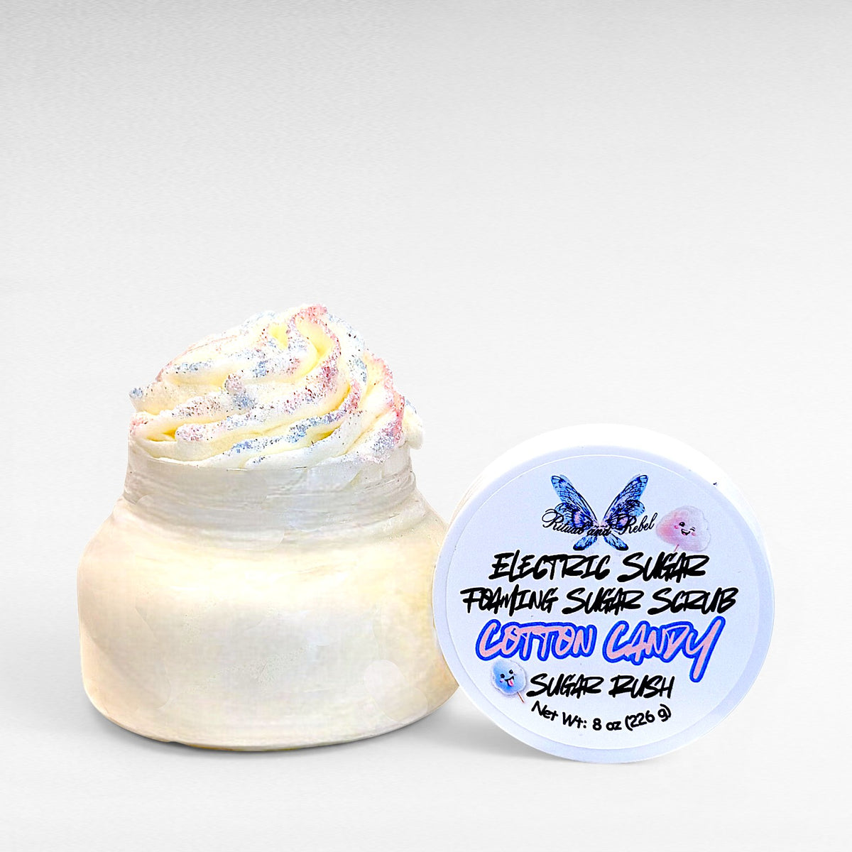 Electric Sugar Foaming Sugar Scrub by Ritual and Rebel body butter in clear plastic jar with white lid 8 oz
