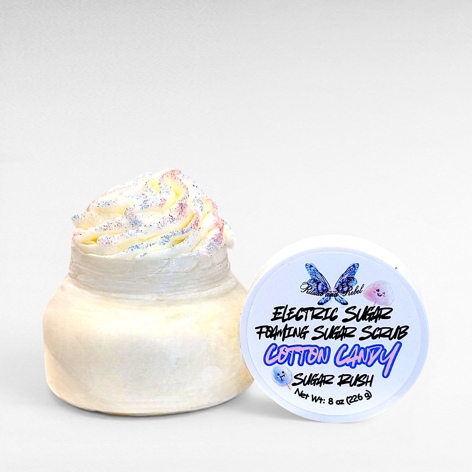 Electric Sugar Foaming Sugar Scrub by Ritual and Rebel body butter in clear plastic jar with white lid 8 oz