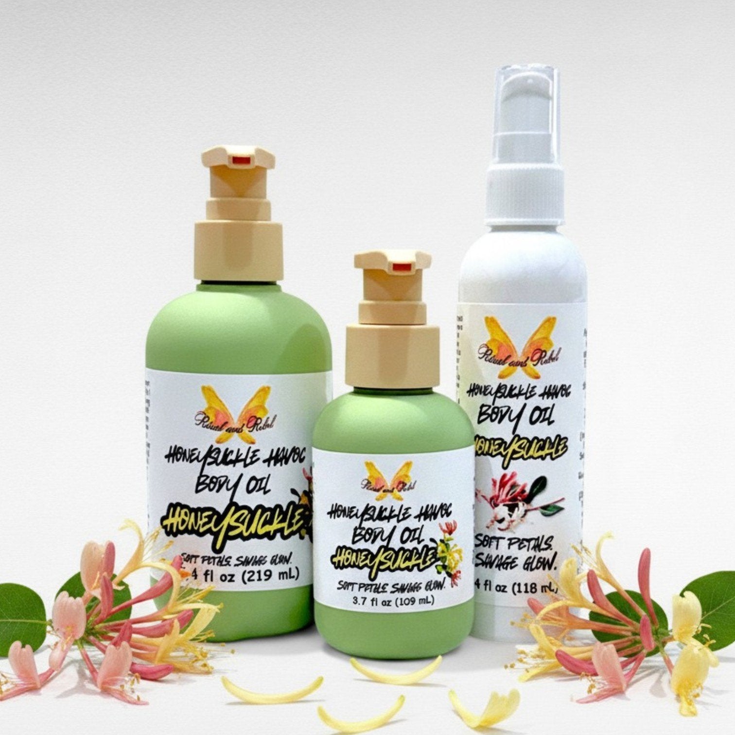 Honeysuckle Havoc Body Oil by Ritual and Rebel 3.7, 4, and 7.4 fl oz bottles green with beige pump and one tall white with serum pump surrounded by honeysuckle flower petals