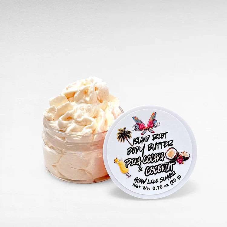 Island Riot Body Butter by Ritual and Rebel Pina Colada and Coconut beige whipped body butter in clear plastic jar with white lid 0.70 oz
