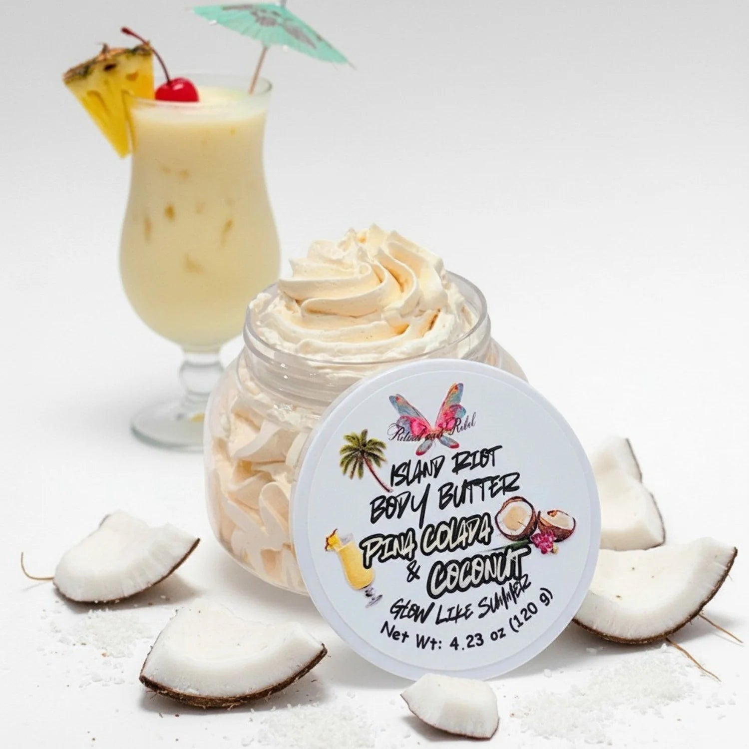 Island Riot Body Butter Pina Colada and Coconut clear plastic jar with whipped body butter and pina colada drink