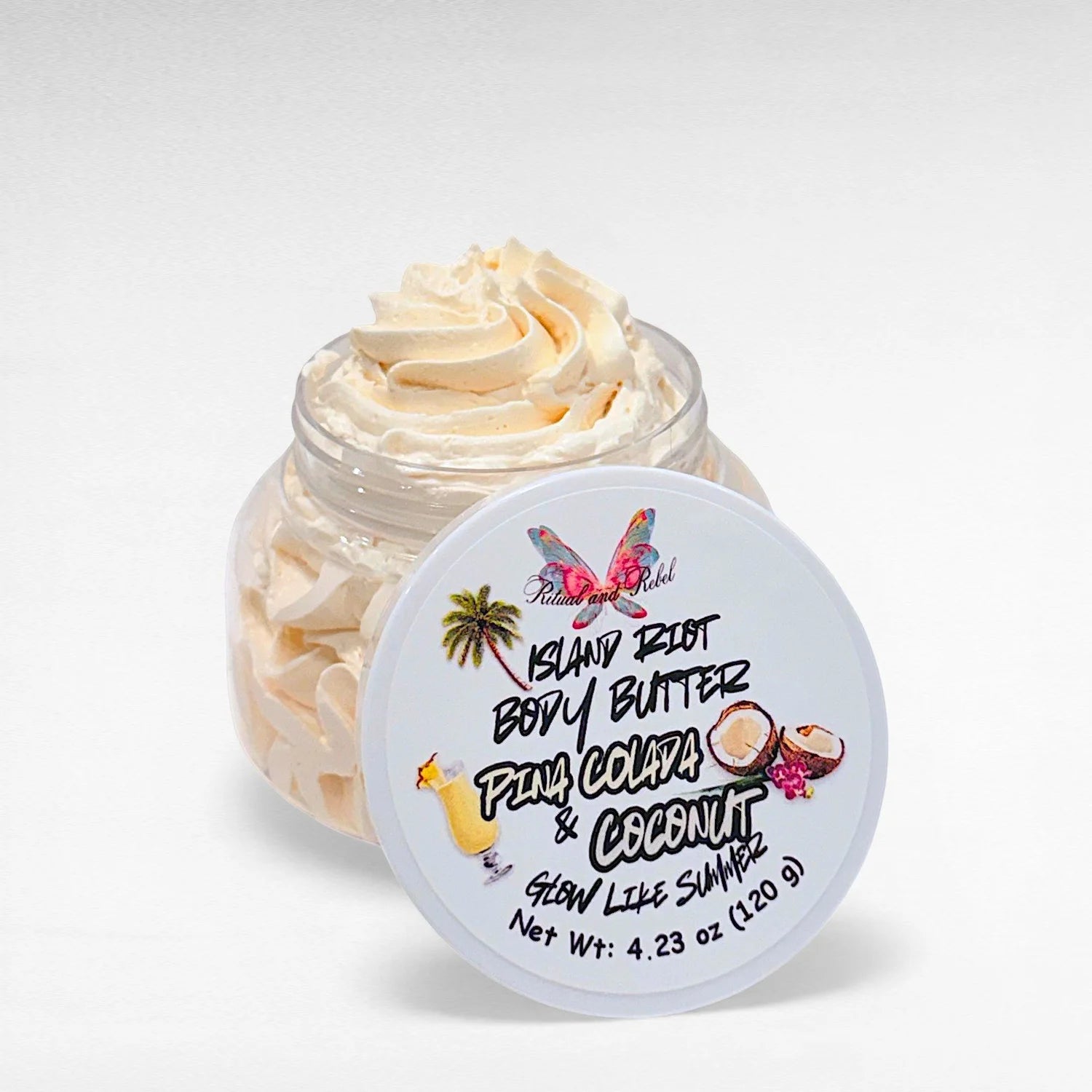 Island Riot Body Butter by Ritual and Rebel Beige color in clear plastic jar with white lid 4.23 oz