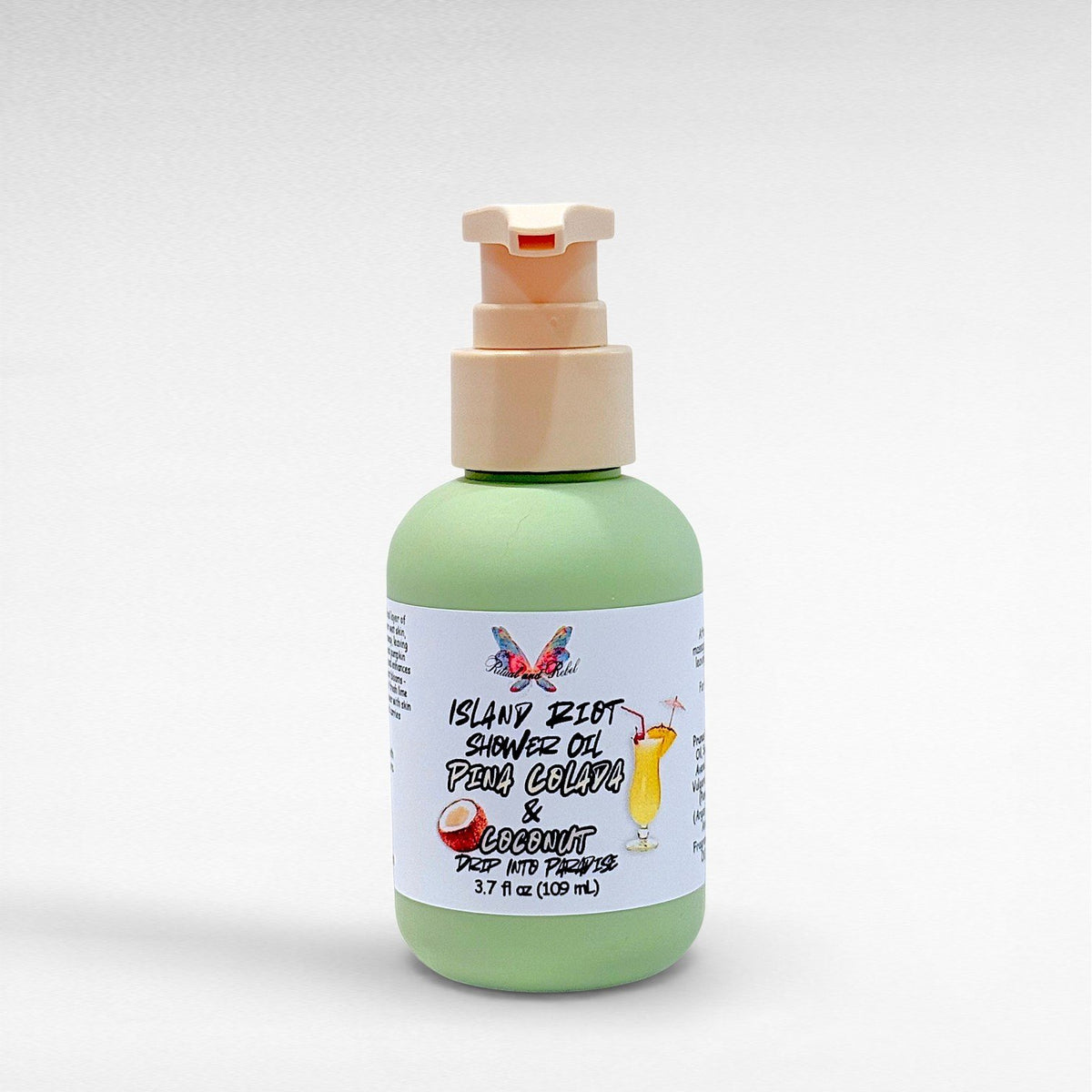 Island Riot Shower Oil Pina Colada and Coconut by Ritual and Rebel 3.7 fl oz green bottle with beige pump