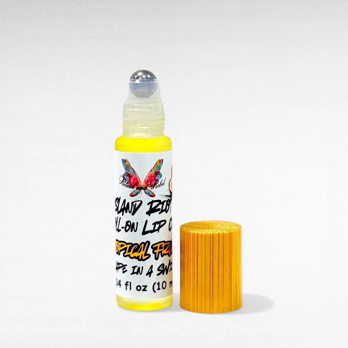 Island Riot Roll-On Lip Oil by Ritual and Rebel glass bottle with bamboo top tropical fruit flavor 10 ml