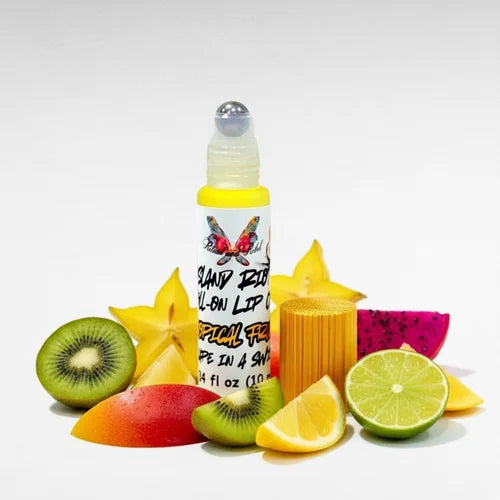 Island Riot Roll-On Lip Oil by Ritual and Rebel glass bottle with bamboo top surrounded by tropical fruits