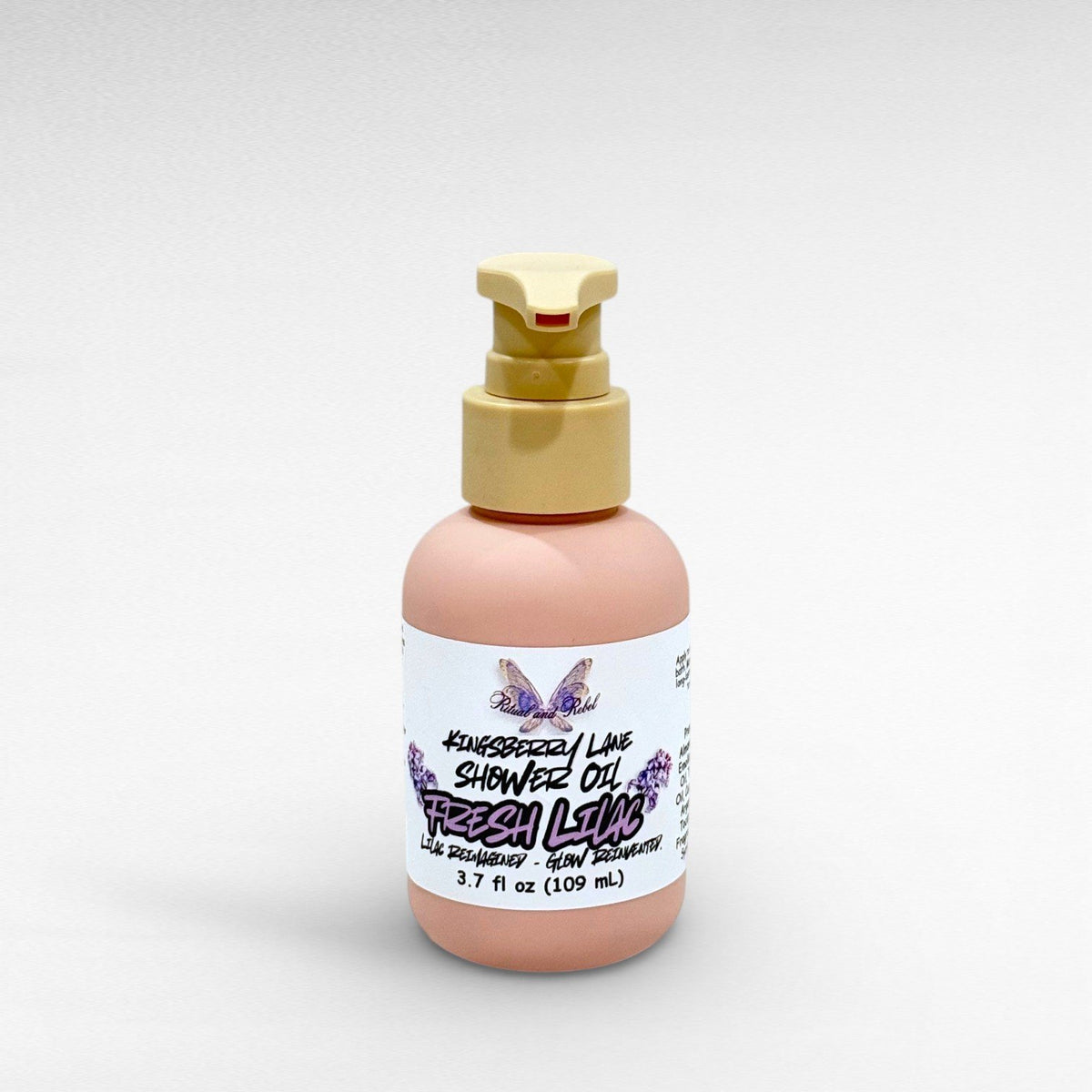 Kingsberry Lane Shower Oil by Ritual and Rebel 3.7 fl oz pink bottle with beige pump 