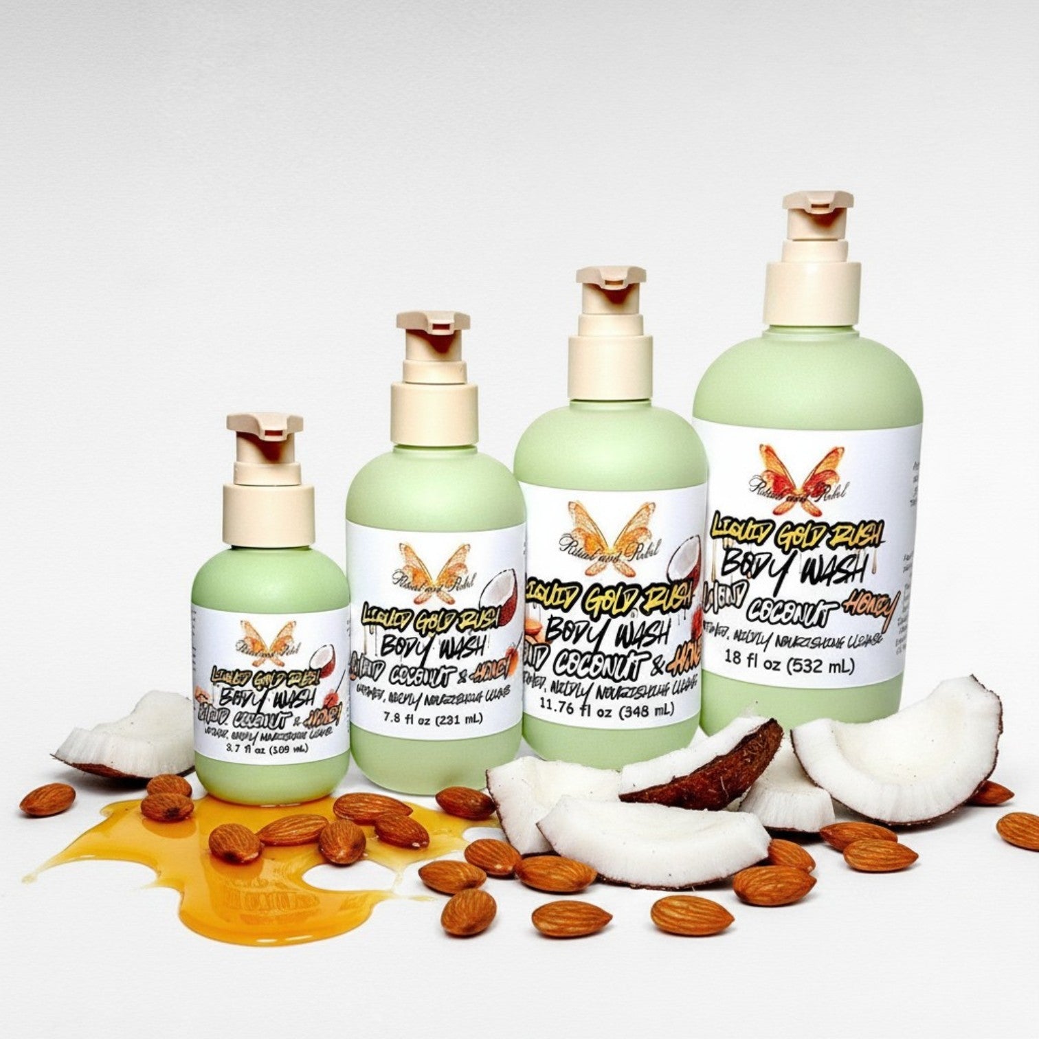 Liquid Gold Rush Body Wash by Ritual and Rebel shows a set of 4 green bottles with pump dispensers on a white background, surrounded by almonds and coconut pieces. 3.7, 7.8, 11.76. and 18 fl oz sizes