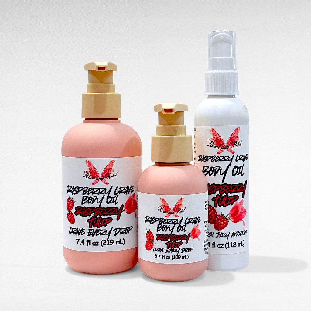 Raspberry Crave Body Oil by Ritual and Rebel 2 pink bottles with beige pumps 7.4 & 3.7 fl oz and one tall white bottle with 4 fl oz and serum pump