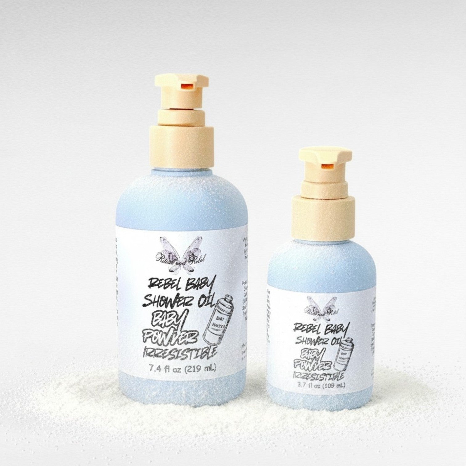 Rebel Baby Shower Oil by Ritual and Rebel light blue bottle with pump 7.4 and 3.7  fl oz light gray background