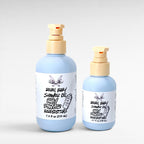 Rebel Baby Shower Oil by Ritual and Rebel light blue bottles with pump 7.4 and 3.7 fl oz light gray background