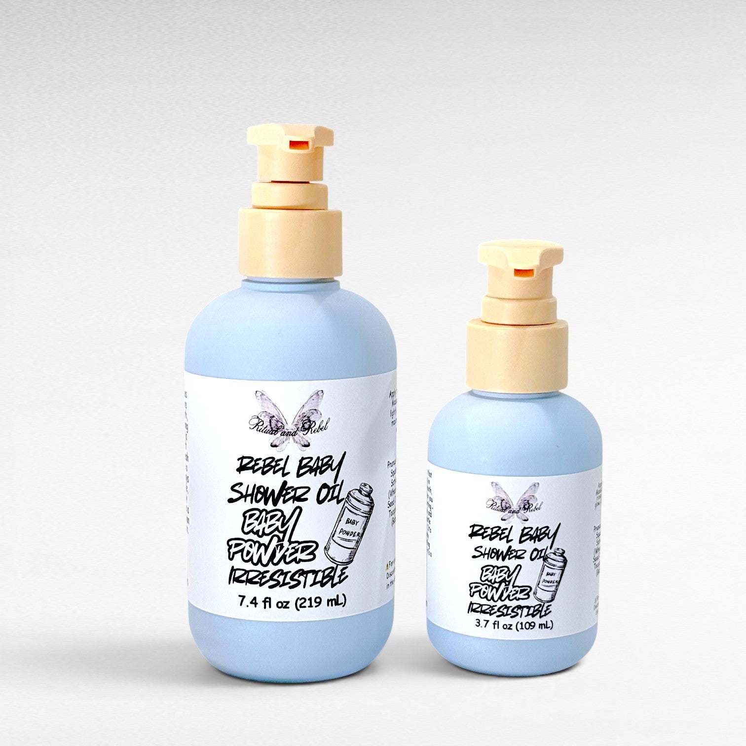 Rebel Baby Shower Oil by Ritual and Rebel light blue bottles with pump 7.4 and 3.7 fl oz light gray background