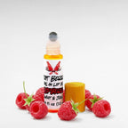 Riot Berry Roll On Lip Oil by Ritual and Rebel glass bottle with metal roll on ball with wood bamboo lid and raspberries surrounding bottle raspberry flavored 10 ml
