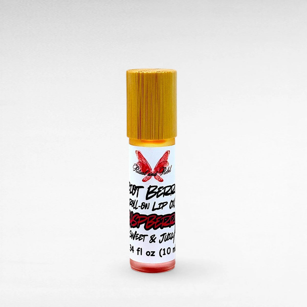 Riot Berry Roll On Lip Oil by Ritual and Rebel glass bottle with metal roll on ball with wood bamboo lid 10 ml
