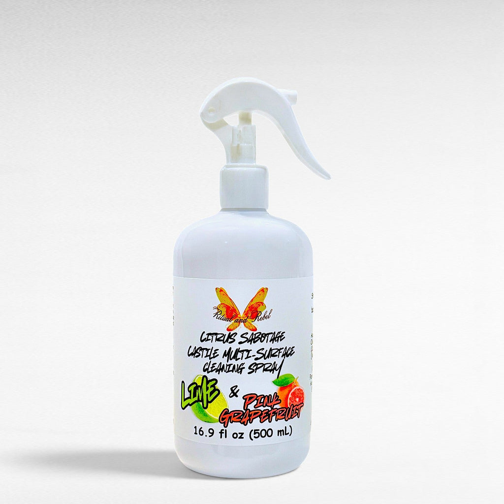 Ritual and Rebel Citrus Sabotage multi-surface cleaning spray in a white bottle with pink grapefruit and lime label.