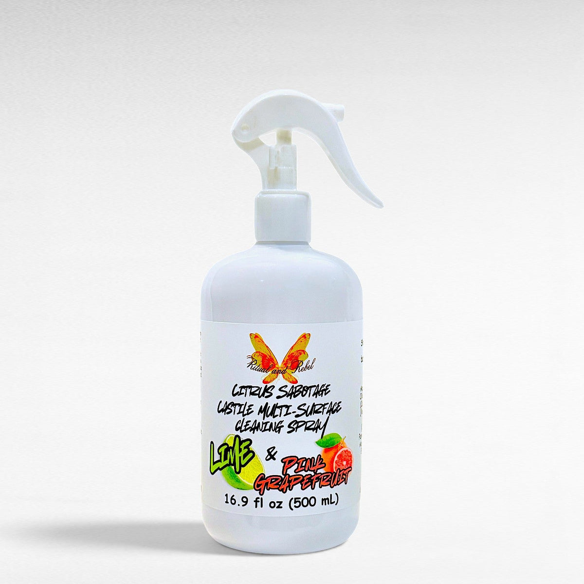 Ritual and Rebel Citrus Sabotage multi-surface cleaning spray in a white bottle with pink grapefruit and lime label.