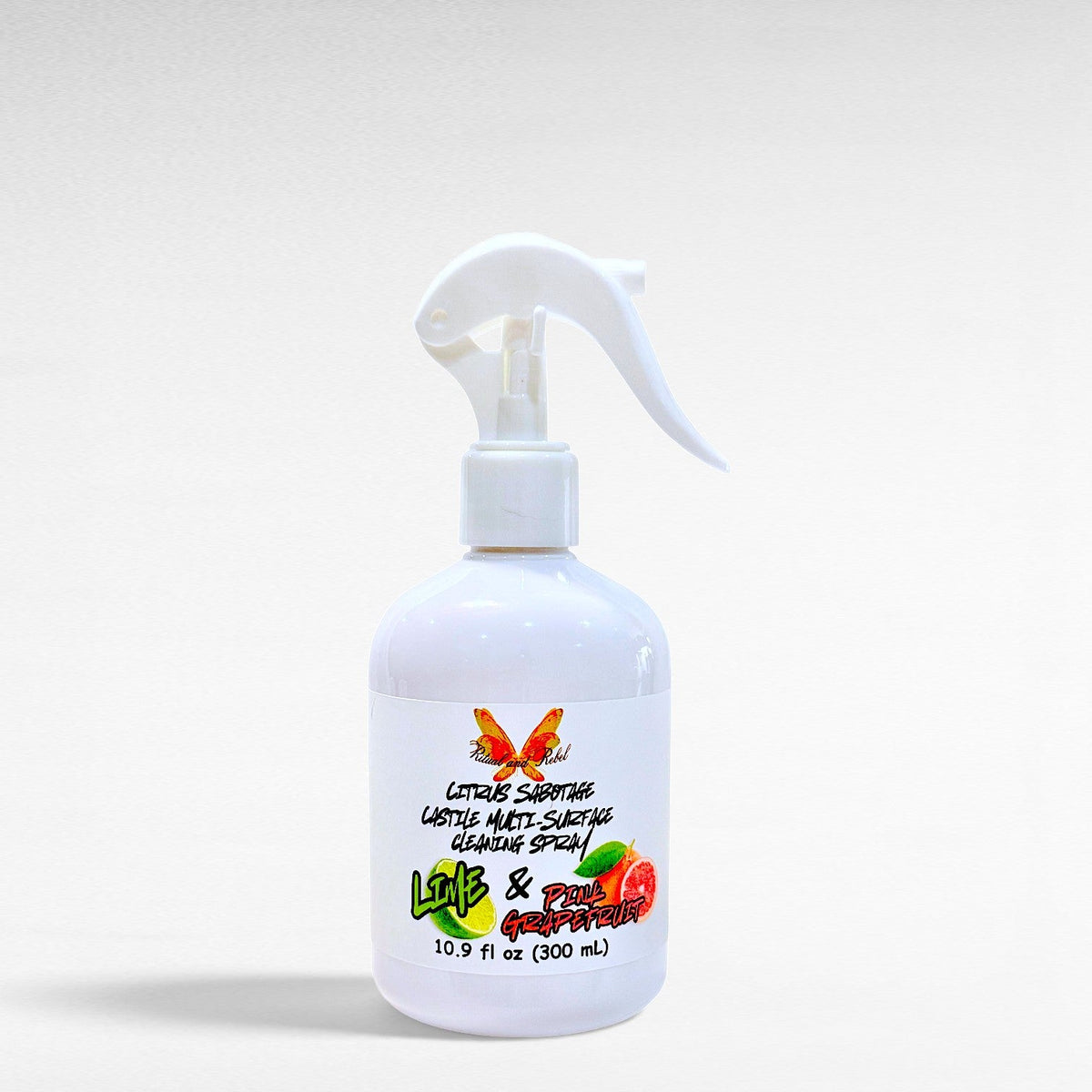 Ritual and Rebel Citrus Sabotage multi-surface cleaning spray in a white bottle with pink grapefruit and lime label.