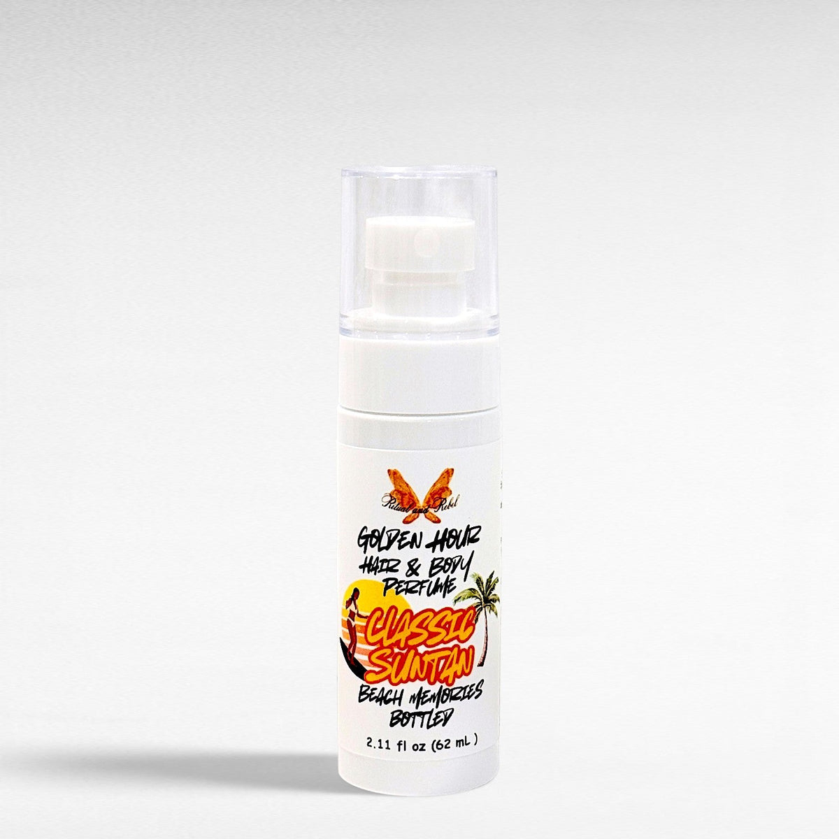 Ritual and Rebel Golden Hour hair and body perfume in a white spray bottle with a beach-themed label.