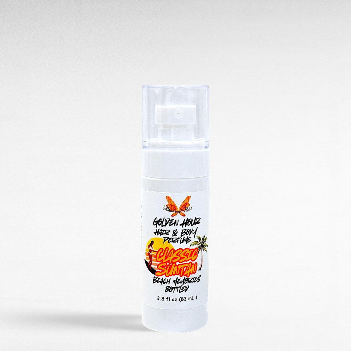 Ritual and Rebel Golden Hour Hair & Body Perfume in a white spray bottle with a classic suntan scent label.