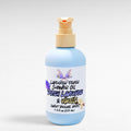 Ritual and Rebel Lavender Fever Shower Oil in a light blue bottle with a pump dispenser and floral label.