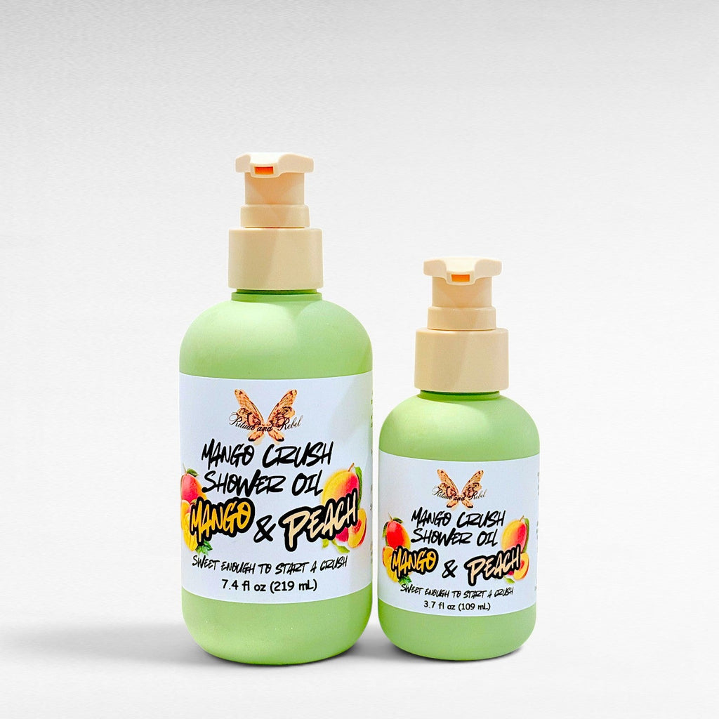 Ritual and Rebel Mango Crush Shower Oil bottles in two sizes with light green packaging and mango peach label art.