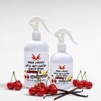 Ritual and Rebel Rogue Cherry Castile multi-surface cleaning spray bottles with fresh cherries and vanilla beans.