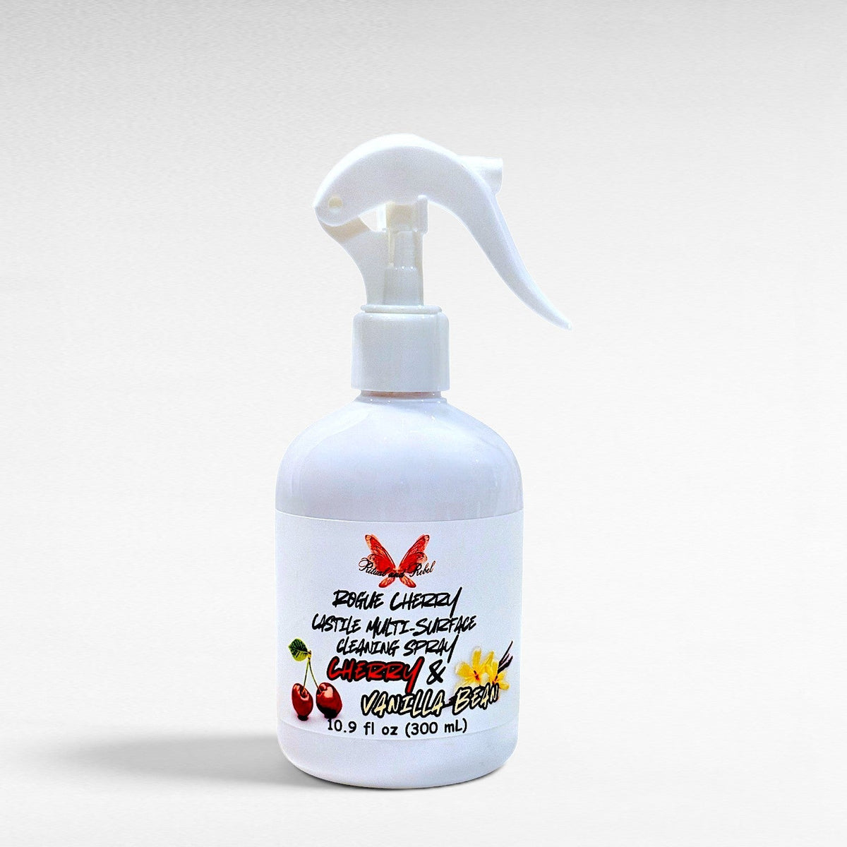 Ritual and Rebel Rogue Cherry Castile multi-surface cleaning spray in a white bottle with a cherry and vanilla label.