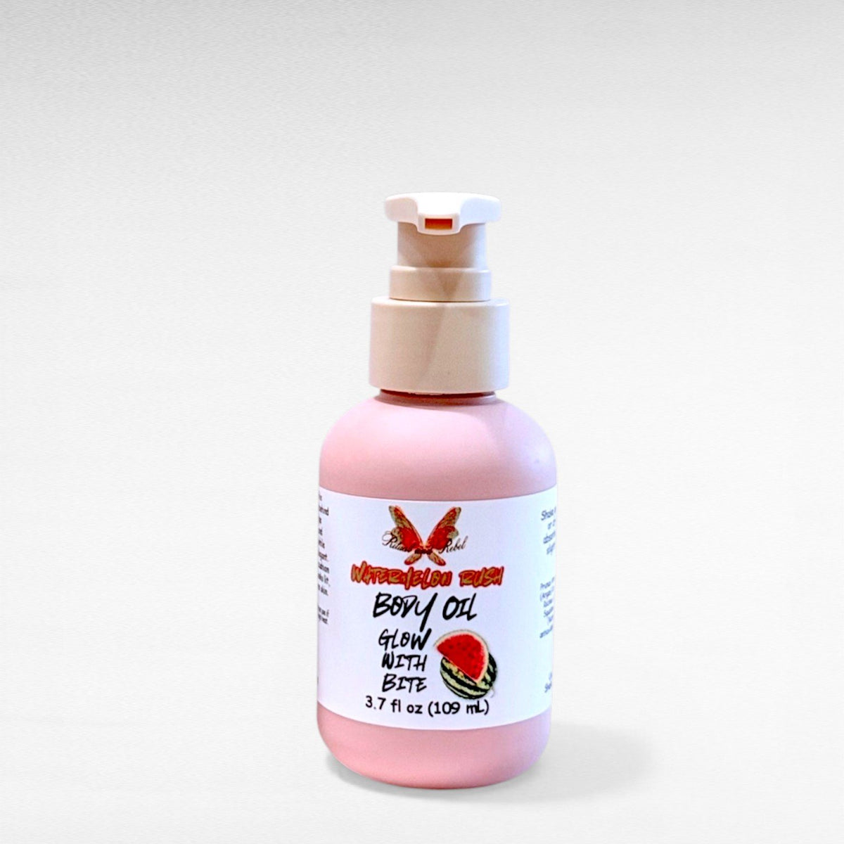 Watermelon Rush Body Oil by Ritual and Rebel pink bottle with beige pump 3.7 fl oz